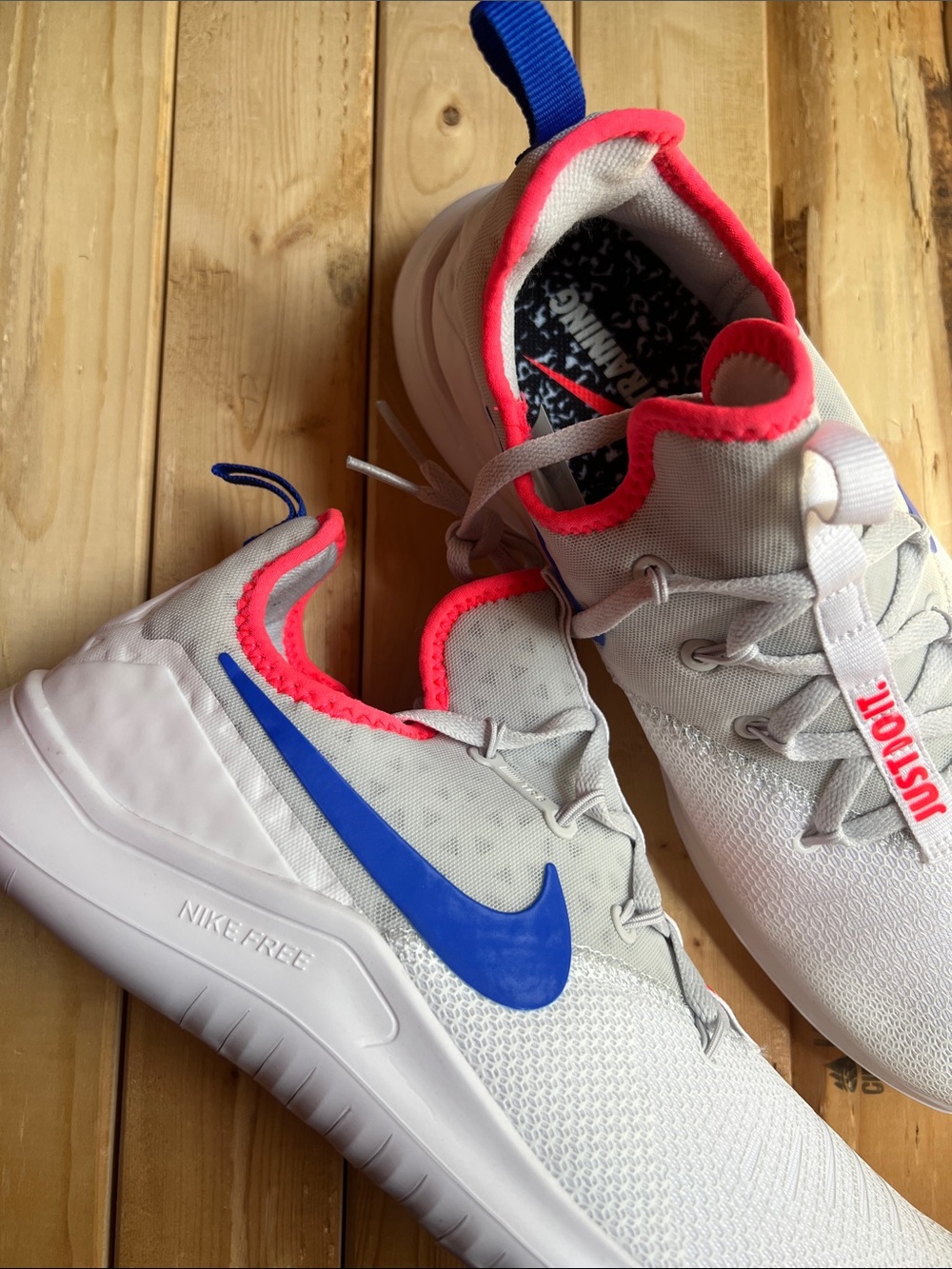 Nike White Sneakers with Blue Swoosh and Pink Trim